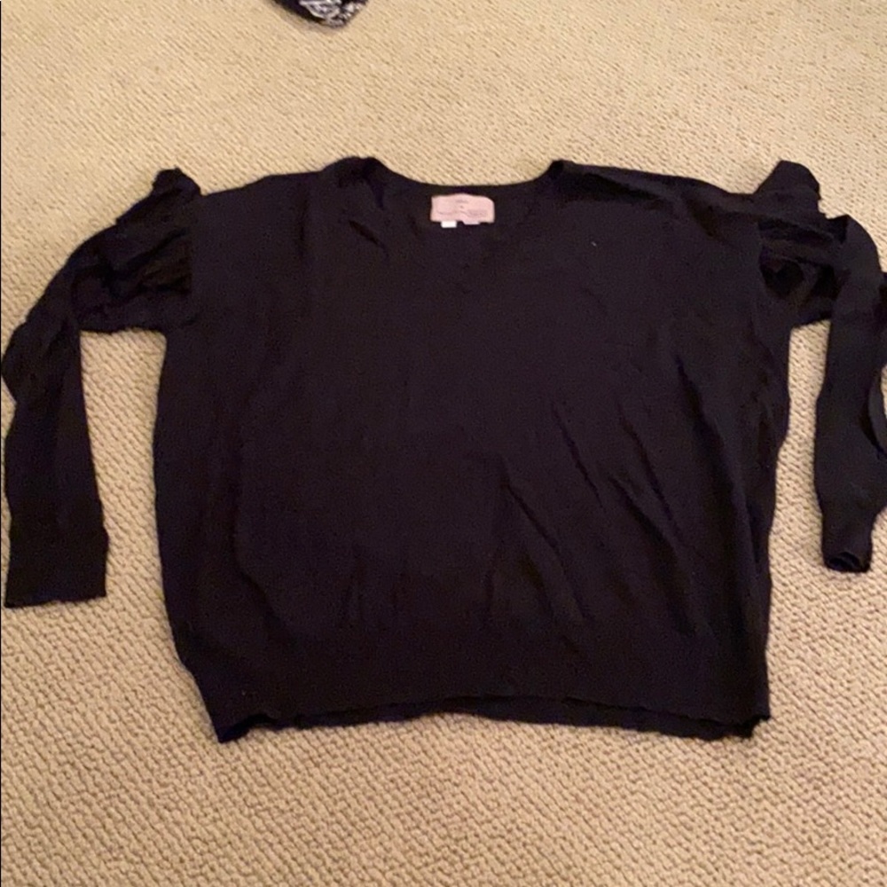 Black V-neck ruffle shoulder sweater